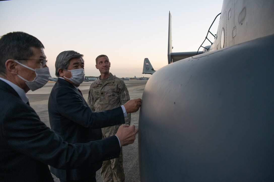 Lt. Col. Tyler Oldham, 21st Special Operations Squadron operation officer, guides a CV-22 Osprey tour at Yokota Air Base, Japan, Nov. 15, 2021. Local community mayors visited Yokota to observe the partnership between the U.S. Air Force and Japan Air Self-Defense Forces, to learn the strategic importance of the 374th Airlift Wing's mission, and its partnership with local communities. (U.S. Air Force photo by Airman 1st Class Brooklyn Golightly)