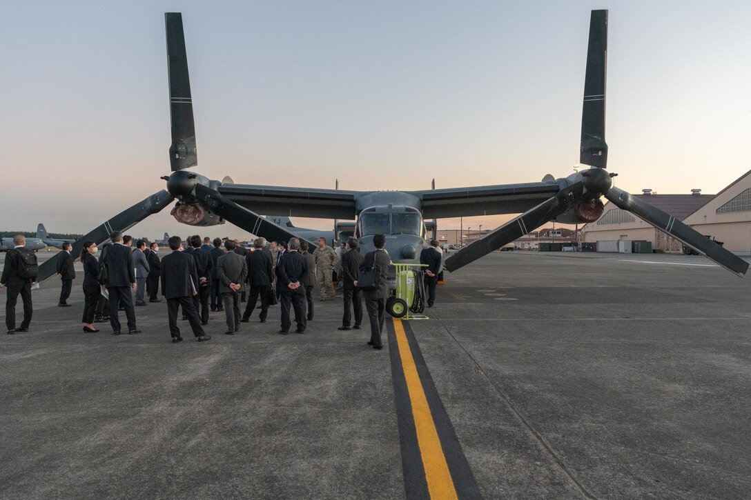 Mayors from the Kanto, Tohoku, and Hokkaido prefectures, tour a CV-22 Osprey static display at Yokota Air Base, Japan, Nov. 15, 2021. Local community mayors visited Yokota to observe the partnership between the U.S. Air Force and Japan Air Self-Defense Forces, to learn the strategic importance of the 374th Airlift Wing's mission, and its partnership with local communities. (U.S. Air Force photo by Airman 1st Class Brooklyn Golightly)
