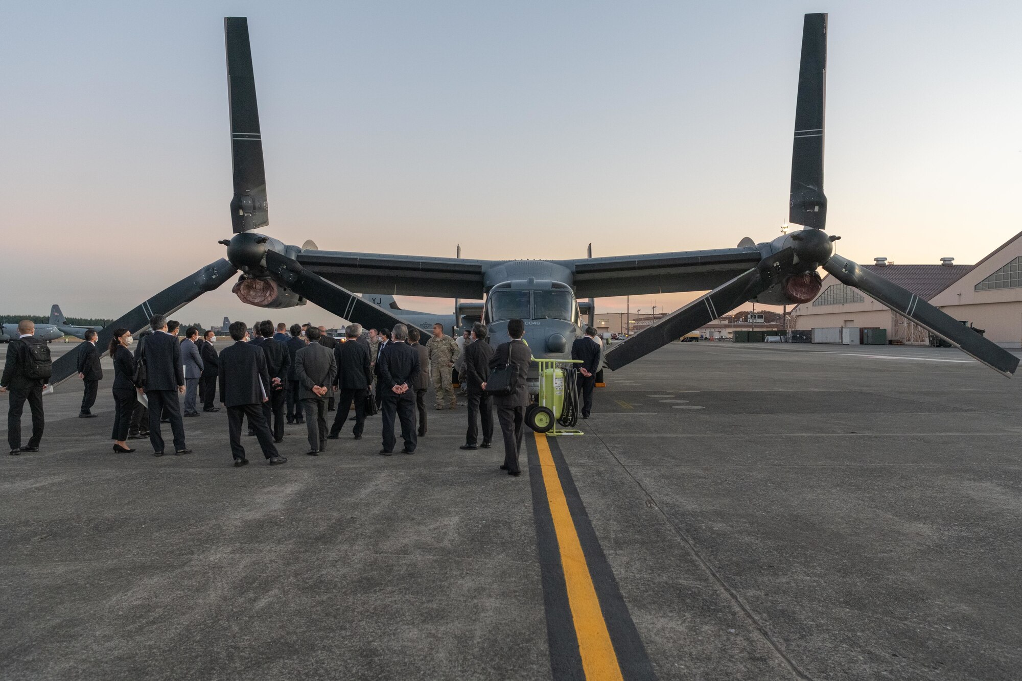 Mayors from the Kanto, Tohoku, and Hokkaido prefectures, tour a CV-22 Osprey static display at Yokota Air Base, Japan, Nov. 15, 2021. Local community mayors visited Yokota to observe the partnership between the U.S. Air Force and Japan Air Self-Defense Forces, to learn the strategic importance of the 374th Airlift Wing's mission, and its partnership with local communities. (U.S. Air Force photo by Airman 1st Class Brooklyn Golightly)