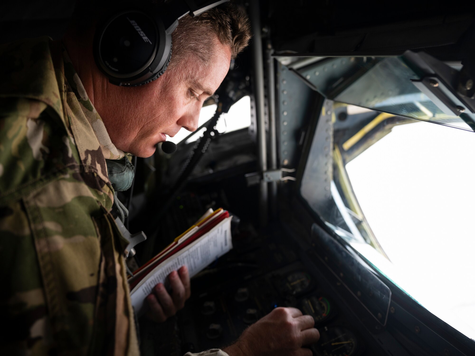 Photo of a U.S. Air Force a KC-135 Stratotanker boom operator conducting aerial refueling operations window.