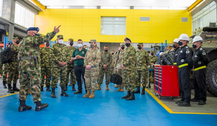 U.S. Army Gen. Laura Richardson, commander of U.S. Southern Command, is briefed by Colombian military maintenance battalion personnel during a visit to Colombia’s Fort Tolemaida