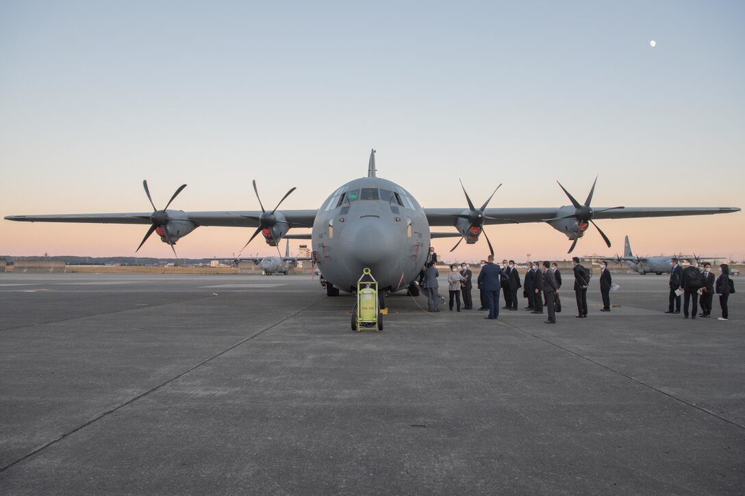Mayors from the Kanto, Tohoku, and Hokkaido prefectures, tour a C-130J Super Hercules static display Yokota Air Base, Japan, Nov. 15, 2021. The mayors toured the C-130J static display to learn about the 374th Airlift Wing's airlift capabilities. (U.S. Air Force photo by Airman 1st Class Brooklyn Golightly)
