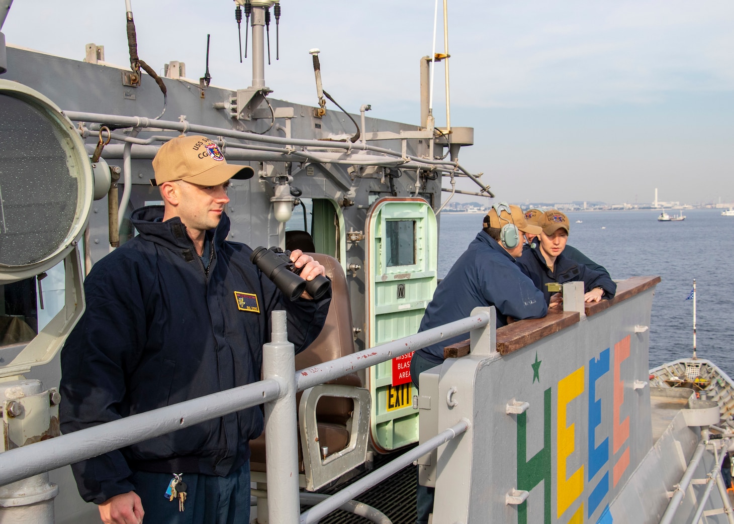 211119-N-JW440-1006 PHILIPPINE SEA (Nov. 19, 2021) Ensign Stone, from Naples, Fla., stands watch on the bridge of the Ticonderoga-class guided-missile cruiser USS Shiloh (CG-67) during a return to port after a 6-month deployment. Shiloh is attached to Commander, Task Force 70/Carrier Strike Group 5 conducting underway operations in support of a free and open Indo-Pacific. (U.S. Navy Photo by Mass Communication Specialist 1st Class Rawad Madanat)