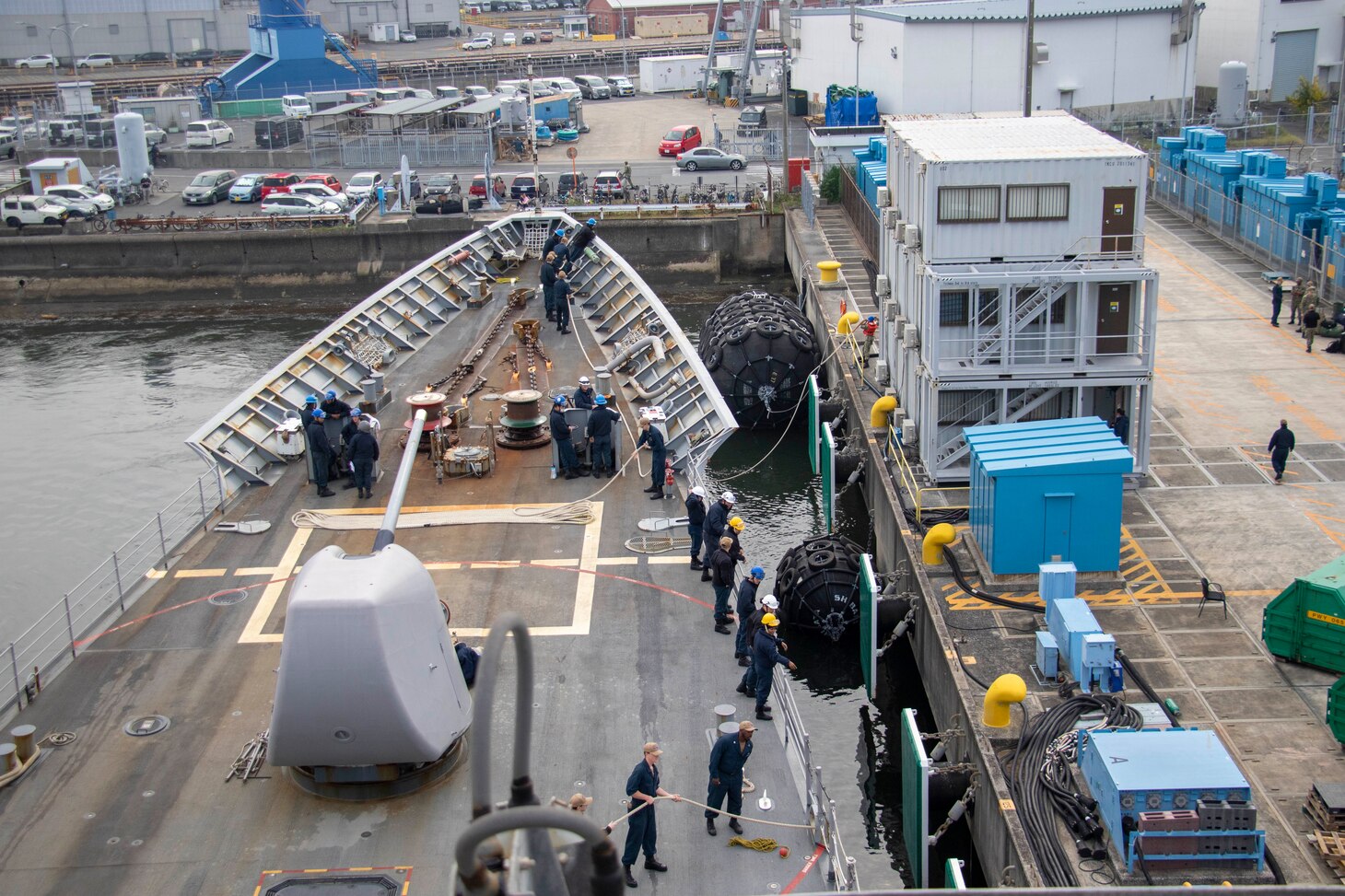 211119-N-JW440-1104 NAVAL STATION YOKOSUKA (Nov. 19, 2021) Sailors handle line aboard  the Ticonderoga-class guided-missile cruiser USS Shiloh (CG-67) during a return to port after a 6-month deployment. Shiloh is attached to Commander, Task Force 70/Carrier Strike Group 5 conducting underway operations in support of a free and open Indo-Pacific. (U.S. Navy Photo by Mass Communication Specialist 1st Class Rawad Madanat)