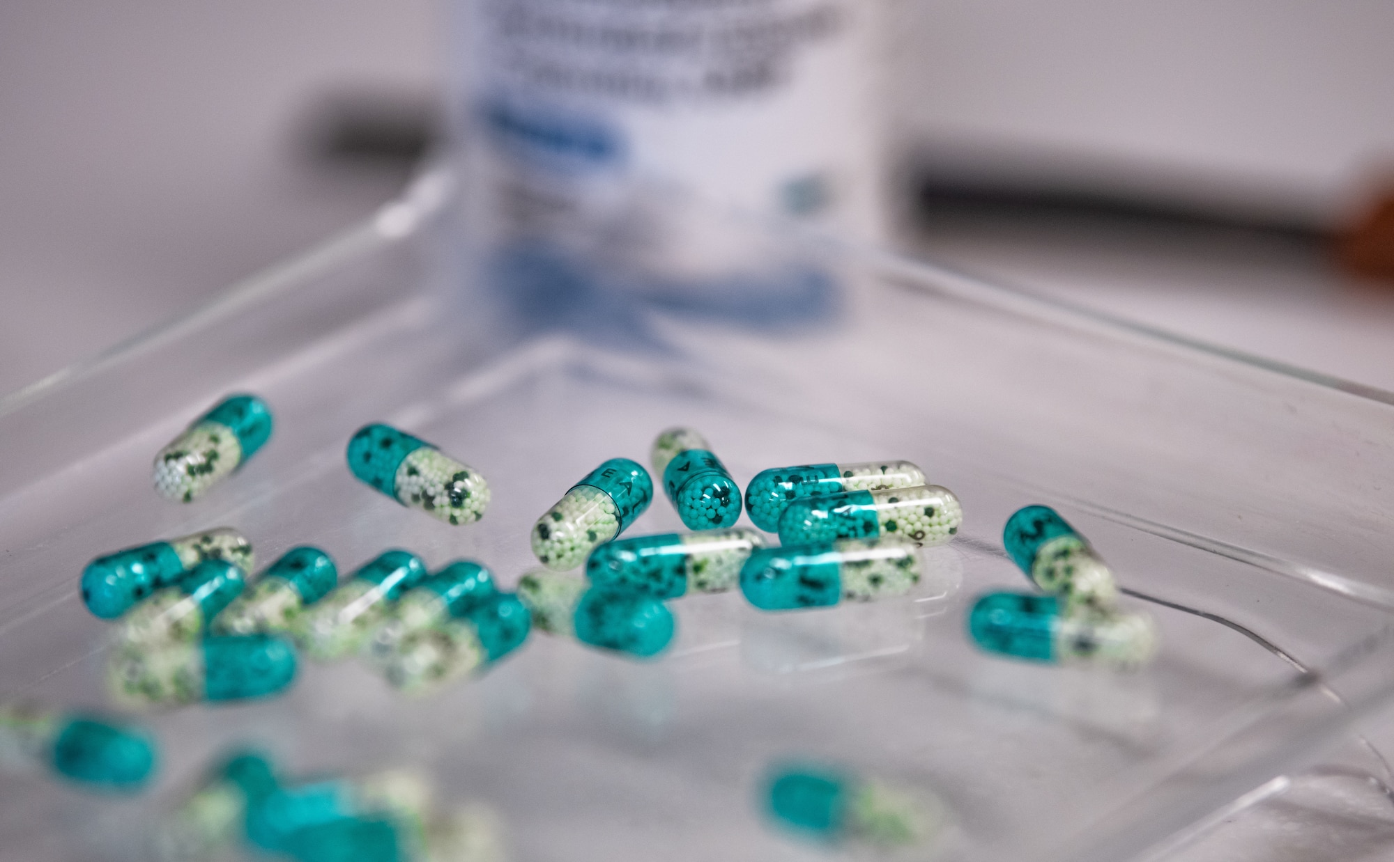 Pills lay scattered on a counting tray.