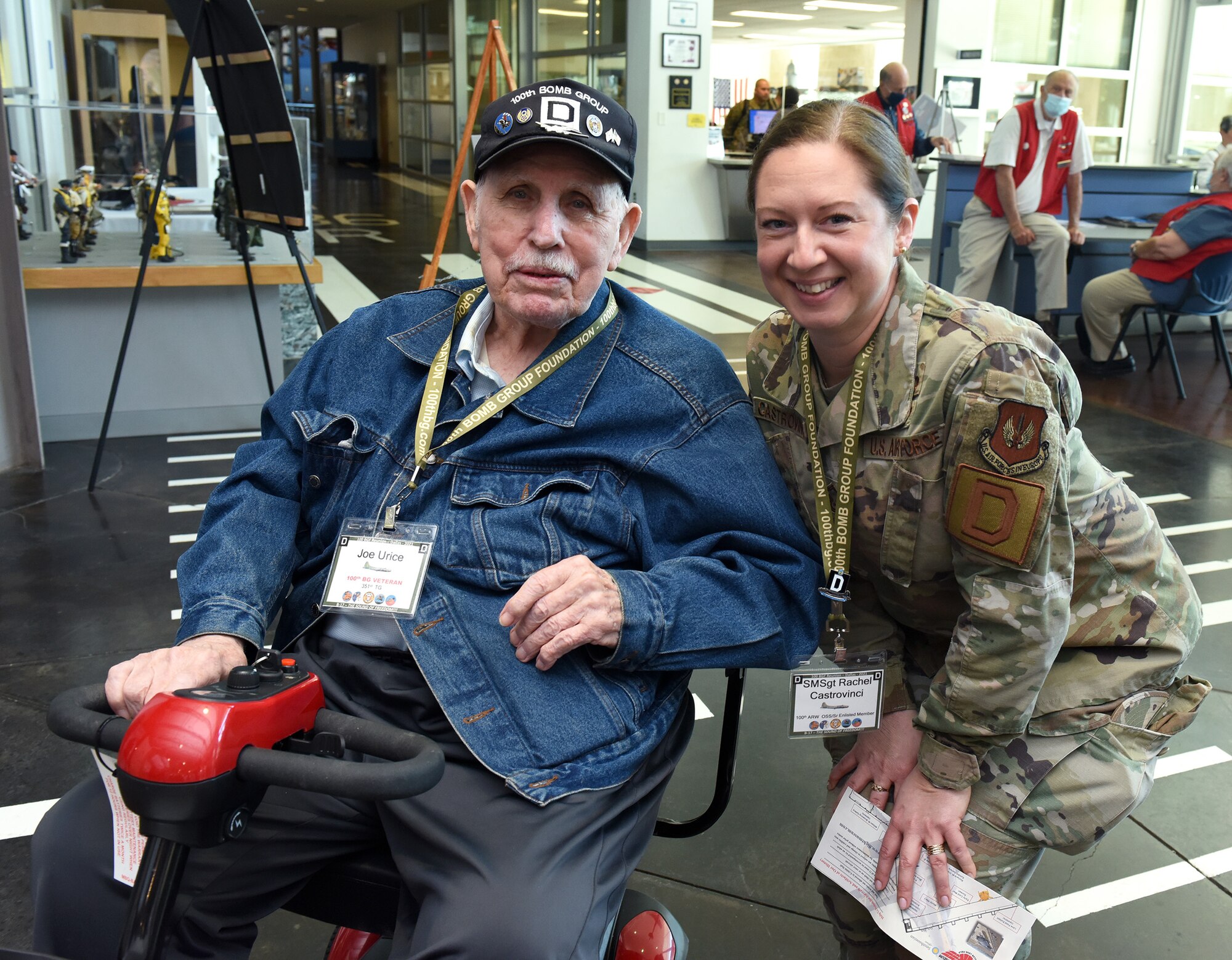 World War II survivor, 100th Bomb Group veteran and B-17 Flying Fortress aircraft tail gunner, retired Staff Sgt. Joe Urice, spends time with Senior Master Sgt. Rachel Castrovinci, 100th Operations Support Squadron senior enlisted leader, at the Frontiers of Flight Museum during the 100th Bomb Group reunion in Dallas, Texas, Oct. 29, 2021. Airmen from the 100th Air Refueling Wing, Royal Air Force Mildenhall, England, attended the reunion and met veterans of the 100th BG and World War II, who were overjoyed to meet those from today's Air Force. (U.S. Air Force photo by Karen Abeyasekere)