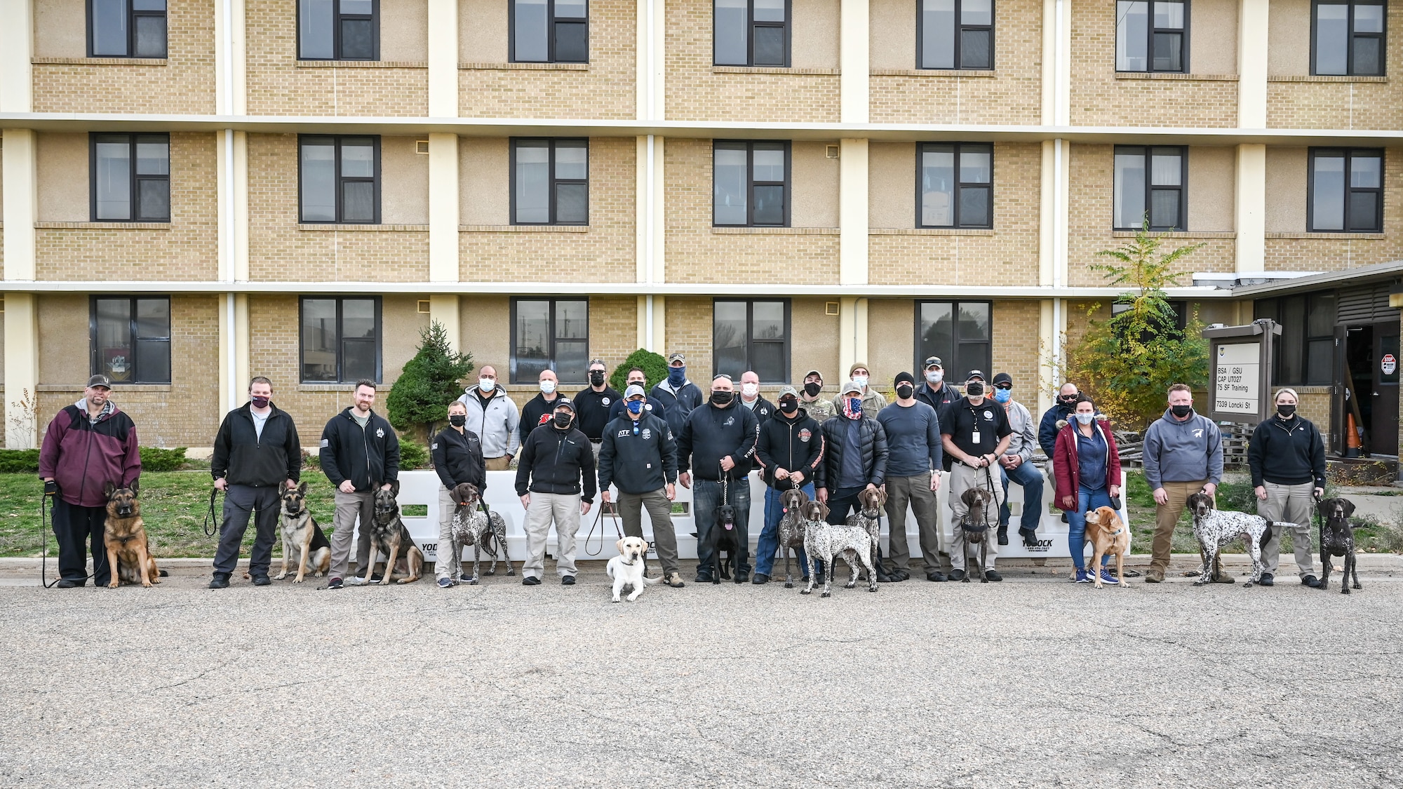 75th Security Forces Squadron Airmen and local, state and federal law enforcement K-9 teams pose for a group photo at the end of joint training Nov. 18, 2021, at Hill Air Force Base, Utah. (U.S. Air Force photo by Cynthia Griggs)