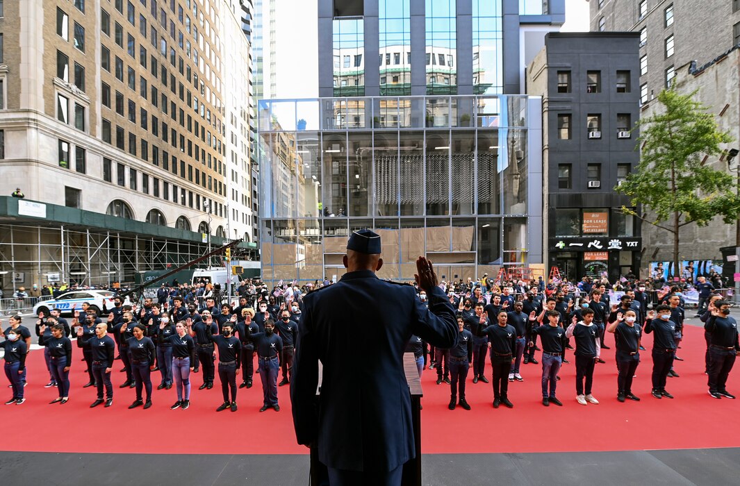 U.S. Air Force Chief of Staff Gen. CQ Brown, Jr., issues the Oath of Enlistment to 68 delayed enlistment program applicants in front of the Veteran’s Day parade review stand