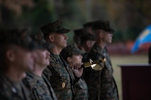 Command Master Chief John Beck, stands at attention during a change of charge ceremony on Camp Lejeune, North Carolina, Nov. 18, 2021. During the ceremony Beck assumed the office of the Command Master Chief of the 2nd Marine Logistics Group. (U.S. Marine Corps photo by Lance Cpl. Meshaq Hylton)