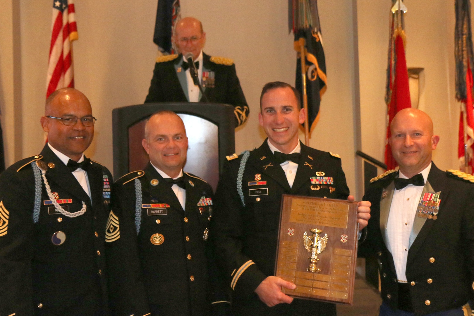 Retired Brig. Gen. Charles B. Faulconer Jr., honorary colonel of the 116th Infantry Regiment, announces the Alpha Company, 1st Battalion, 116th Infantry Regiment, 116th Infantry Brigade Combat Team, as the recipient of the 116th Regiment Superior Unit Award during the 116th's 53rd annual regimental muster Nov. 13, 2021, in Staunton, Virginia. Col. Christopher J. Samulski and Command Sgt. Maj. Irving N. Reed Jr., the 116th IBCT command team, presented the award to Capt. Daniel K. Fida and 1st Sgt. Thomas E. Barrett, the Alpha Company command team.