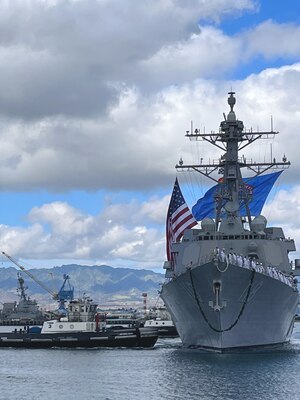 The future USS Daniel Inouye (DDG 118) arrives at Joint Base Pearl Harbor-Hickam.