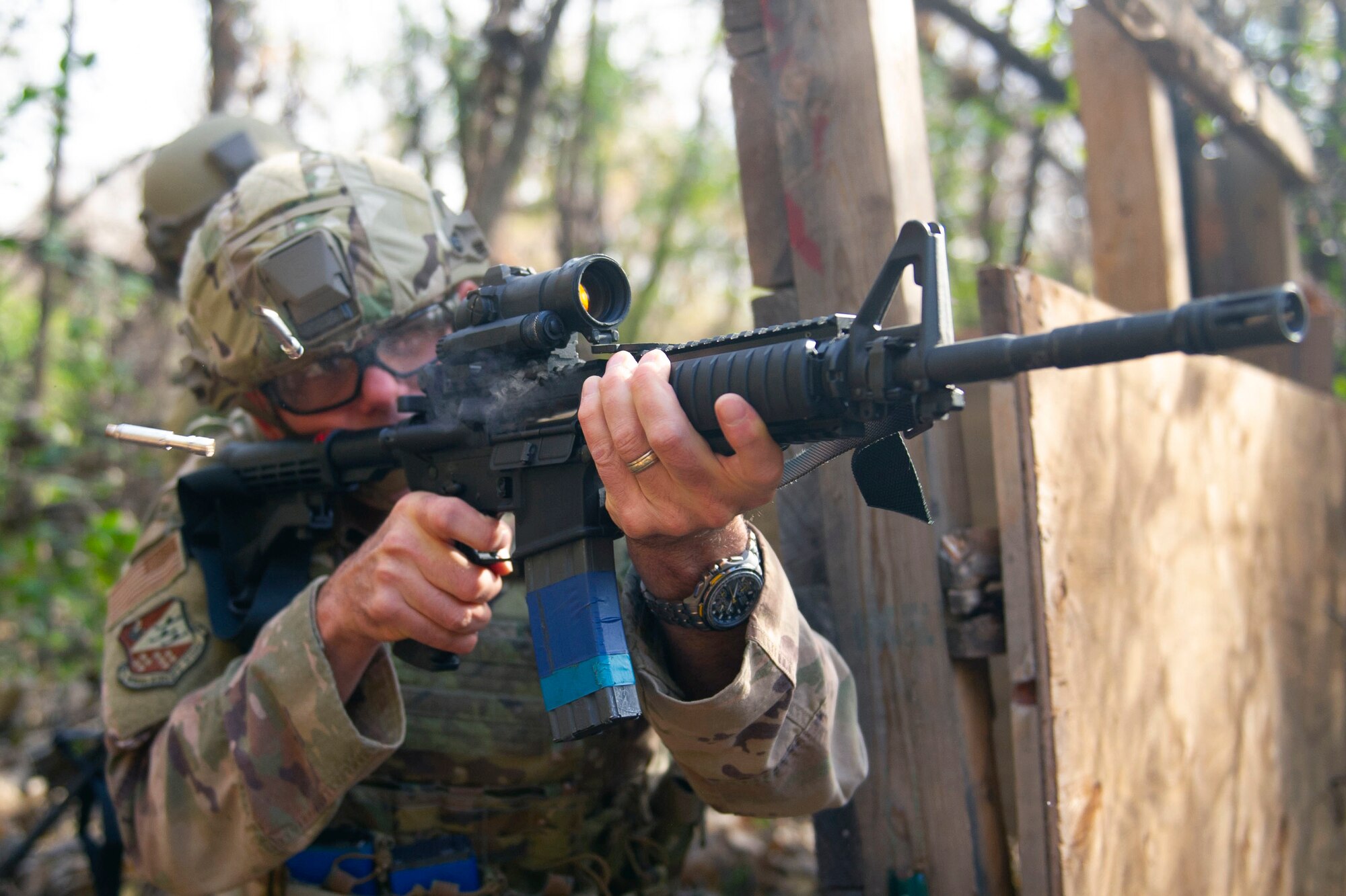 An Airman fires an M4 carbine