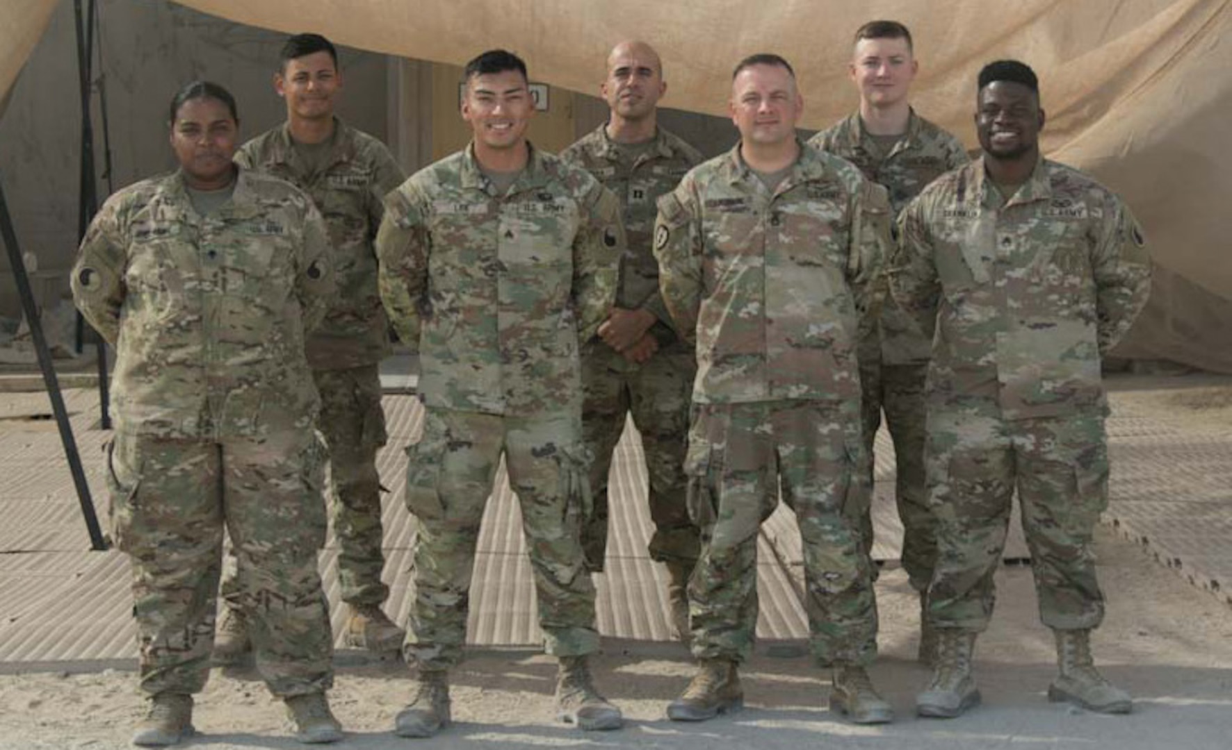 29th Infantry Division Soldiers who escorted vulnerable Afghans during Operation Allies Refuge pose for a photo shortly after the mission ended. The team drove more than 7,500 miles in 160 trips in support of the mission.