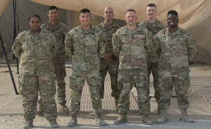 29th Infantry Division Soldiers who escorted vulnerable Afghans during Operation Allies Refuge pose for a photo shortly after the mission ended. The team drove more than 7,500 miles in 160 trips in support of the mission.