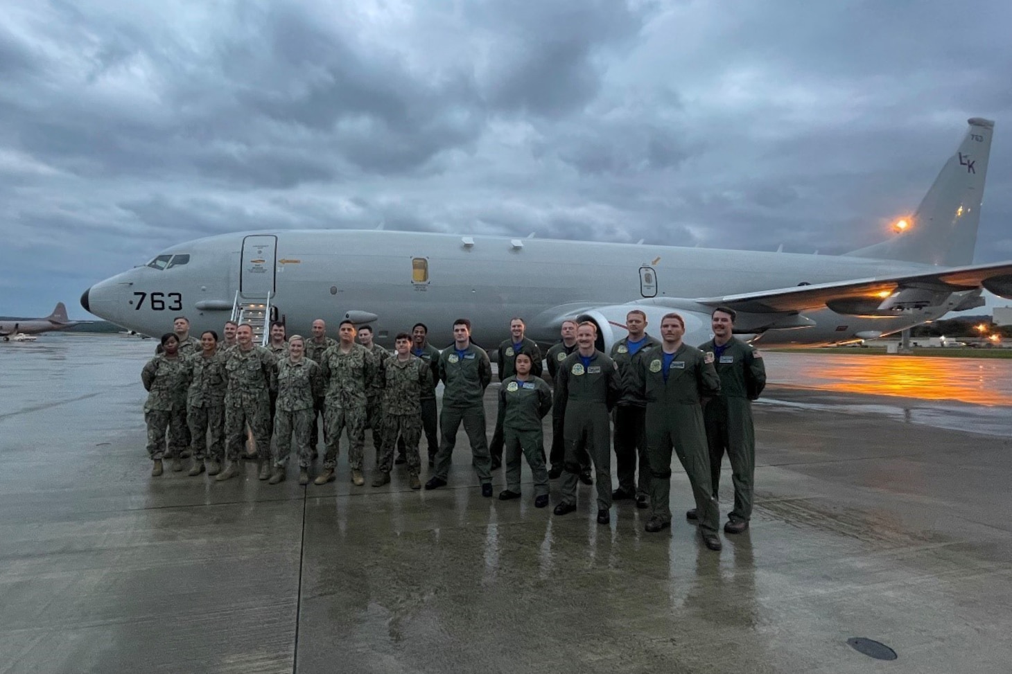 ANDERSEN AIR FORCE BASE, Guam (Nov. 13, 2021) Aircrew, maintenance crew and combat support crew pose in front of a P-8A Poseidon following the completion of a successful search and rescue detachment. VP-26 conducts maritime patrol and reconnaissance as well as theater outreach operations as part of a rotational deployment to the U.S. 7th Fleet area of operations. (U.S. Navy photo by Lt. Mitchell Chen)