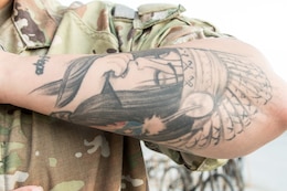 Staff Sgt. Thornton shows tatoos