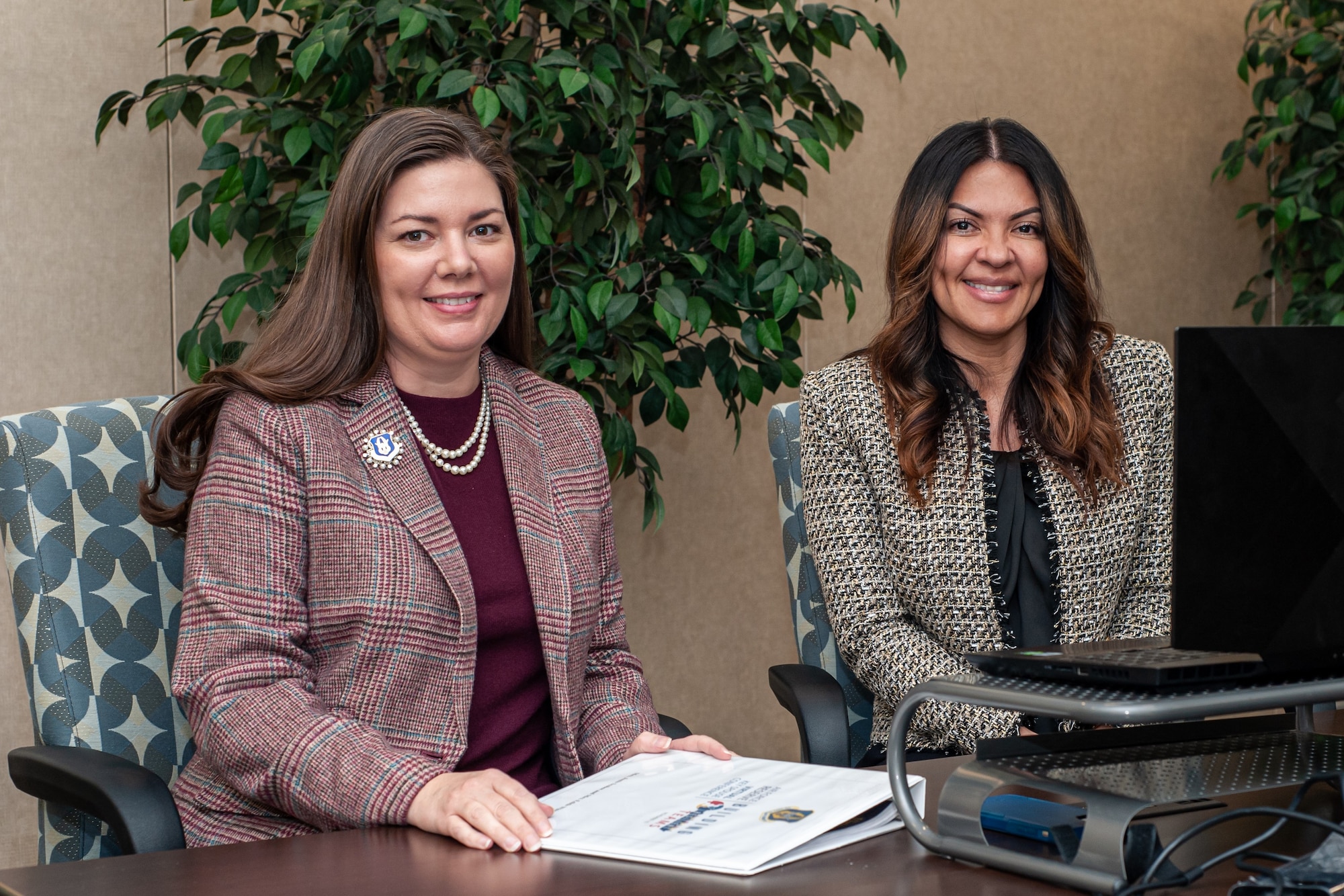 Photo of Janis Scobee, Air Force Reserve Command senior key spouse, and Edith White, Air Force Reserve Command senior enlisted key spouse, posing for a photo before delivering closing remarks for the 2021 AFRC Virtual Key Spouse Conference Nov. 10, 2021.