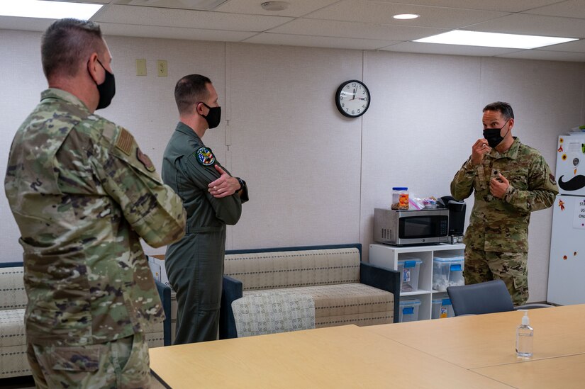 U.S. Air Force Lt. Col. Daniel Gross, right, 633d Medical Group mental health flight commander, briefs Col. William Creeden, center, 1st Fighter Wing commander, and Col. Gregory Beaulieu, left, Joint Base Langley-Eustis commander, at JBLE, Virginia, Nov. 18, 2021