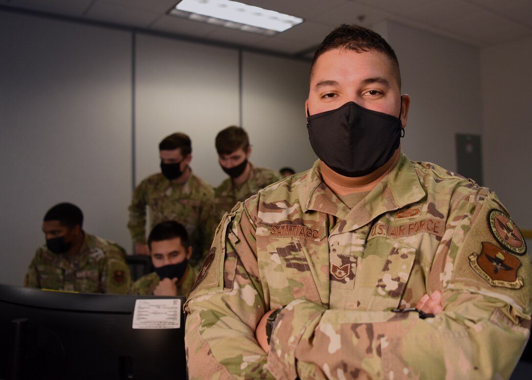 U.S. Air Force Staff Sgt. Yomar Santiago-Henriguez, 313th Training Squadron Distributed Common Ground System course instructor, poses for a portrait in his classroom on Goodfellow Air Force Base, Texas, Nov. 17, 2021. As a building manager Santiago-Henriguez, spearheaded fixing the heating, ventilation and air conditioning system inside a sensitive compartmented information facility with collaboration of the 17th Civil Engineering Squadron and SCIF’s special security office. (U.S. Air Force photo by Senior Airman Abbey Rieves)