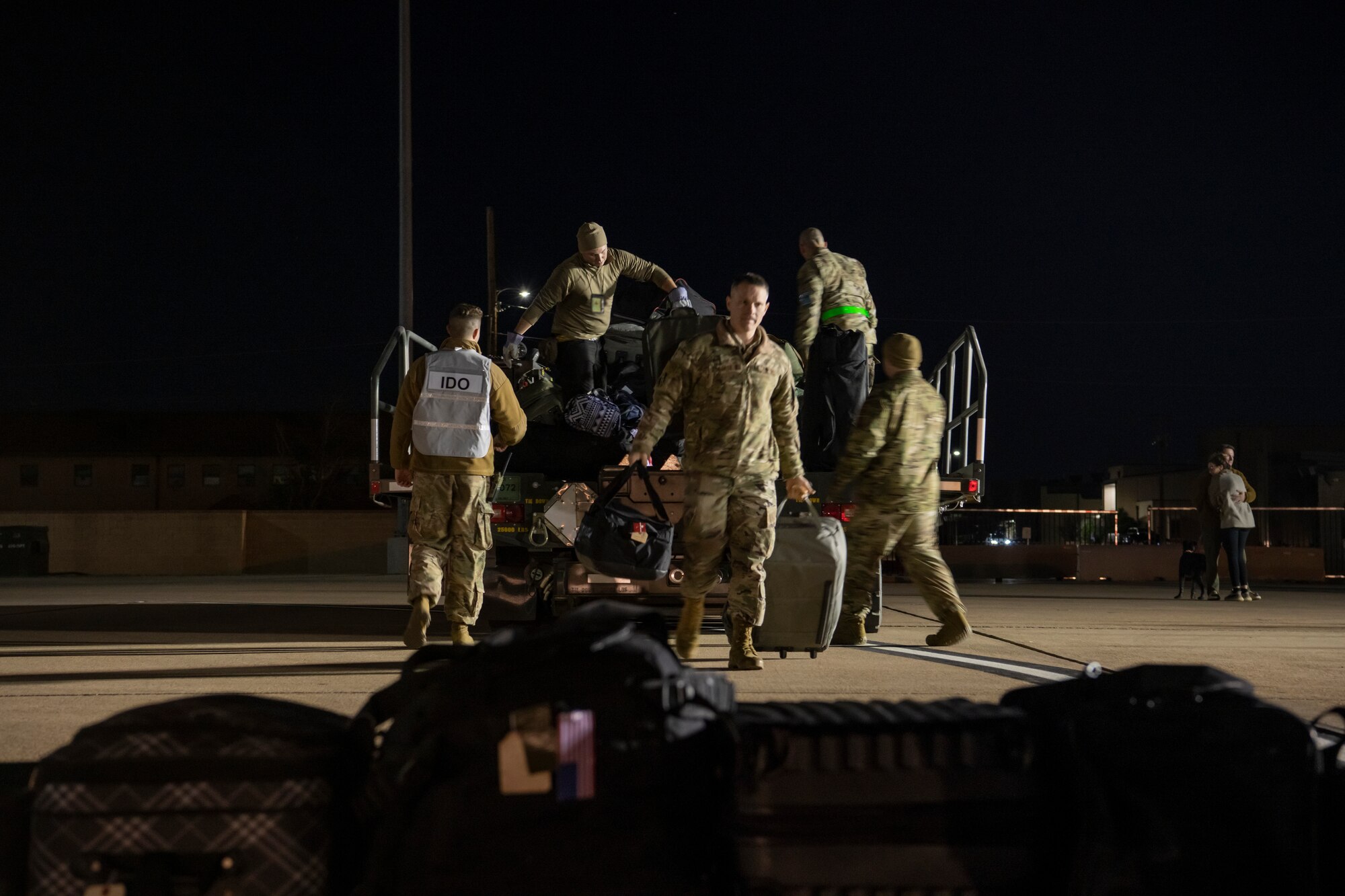Airmen assigned to the 7th Bomb Wing unpack baggage for Airmen who returned to Dyess Air Force Base, Texas, Nov. 18, 2021, from a Bomber Task Force Europe deployment.