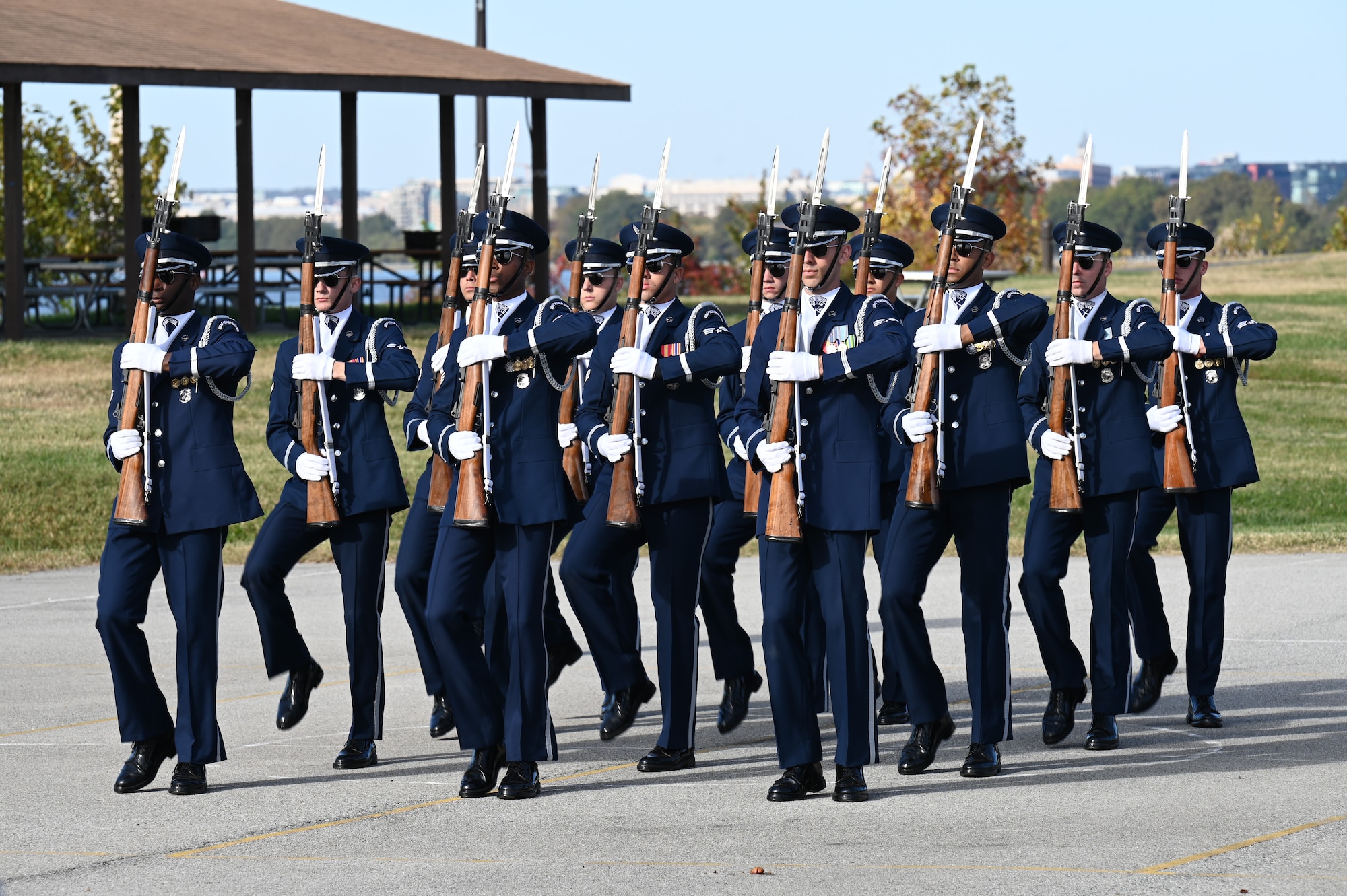 The United States Air Force Honor Guard Drill Team performs for students and parents from Brent Elementary School during a military immersion event on Joint Base Anacostia-Bolling, Washington, D.C., Nov. 6, 2021. U.S. Air Force, Army and Coast Guard members held demonstrations for the military and civilian students to learn about military customs and courtesies while increasing their understanding of the military lifestyle. (U.S. Air Force photo by Airman 1st Class Anna Smith)