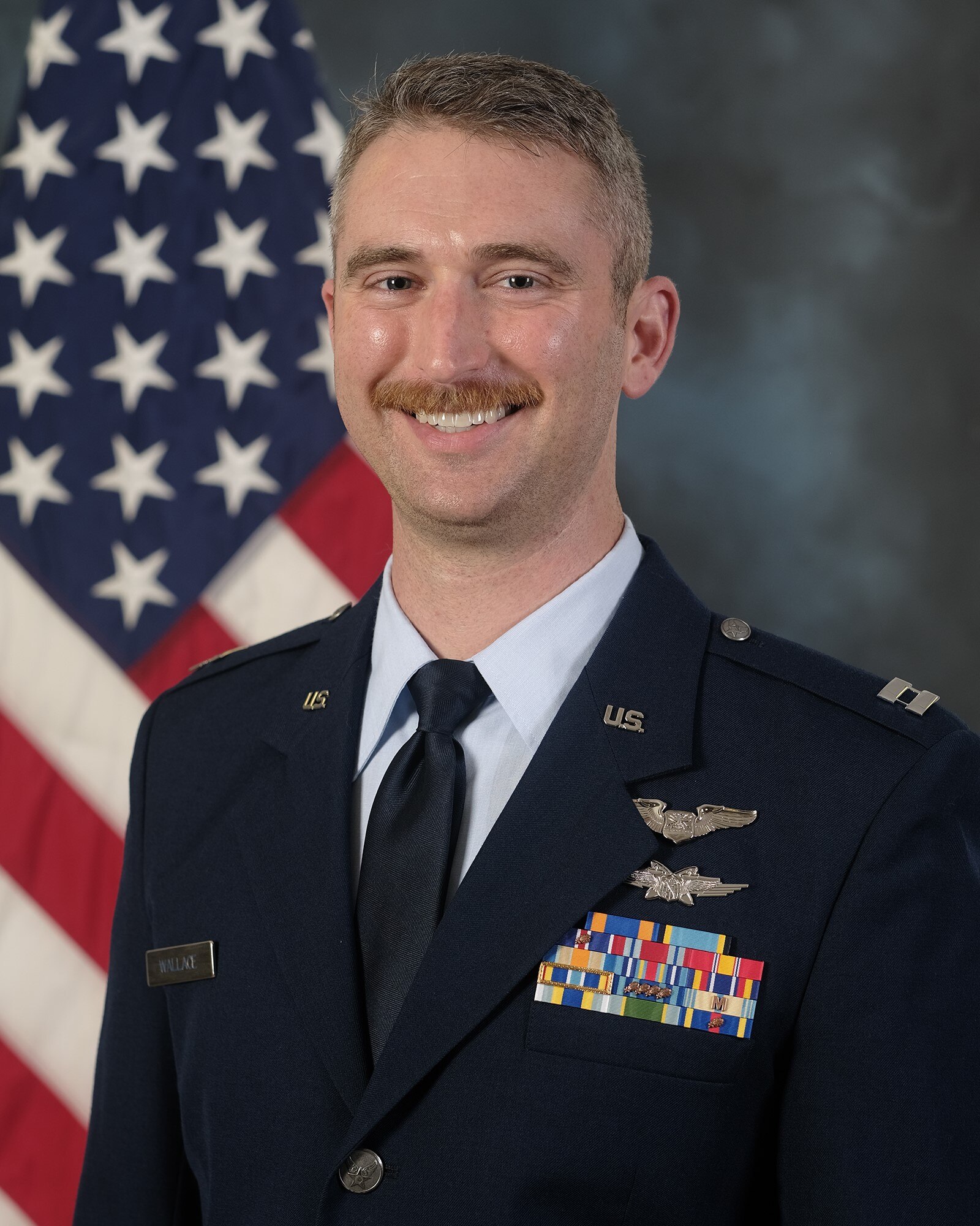 photo of Captain Daniel Wallace with U.S. Flag in background