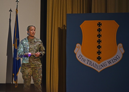 U.S. Air Force Chief Master Sgt. Rebecca Arbona, 17th Training Wing command chief, speaks at the Commander’s Call on Goodfellow Air Force Base, Texas, Nov. 19, 2021. Arbona emphasized that each Airman involved in the mission is important and to look at the bigger picture and to remember each person contributes something different.  (U.S. Air Force photo by Senior Airman Ashley Thrash)