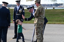 Members of the United States Air Force Honor Guard Drill Team interact with a Brent Elementary student following the drill team’s performance at a military immersion event on Joint Base Anacostia-Bolling, Washington, D.C., Nov. 6, 2021. U.S. Air Force, Army and Coast Guard members held demonstrations for the military and civilian students to learn about military customs and courtesies while increasing their understanding of the military lifestyle. Military and civilian students and families from the off-base D.C. school attended this event to experience military customs. (U.S. Air Force photo by Airman 1st Class Anna Smith)