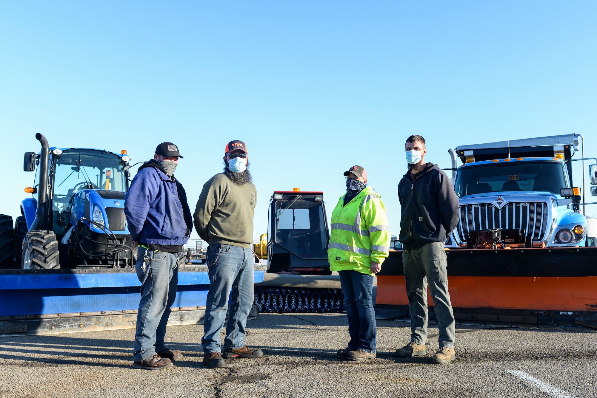 Members of the 88th Civil Engineer Squadron snow removal team pose in front of some of a couple snow plows and a sidewalk sweeper outside their building at Wright-Patterson Air Force Base, Ohio, Feb. 23, 2020. From November to April the team runs 24-hour operations with as many as 30 pieces of equipment to ensure the mission of Wright-Patt can continue. (U.S. Air Force photo by Wesley Farnsworth)