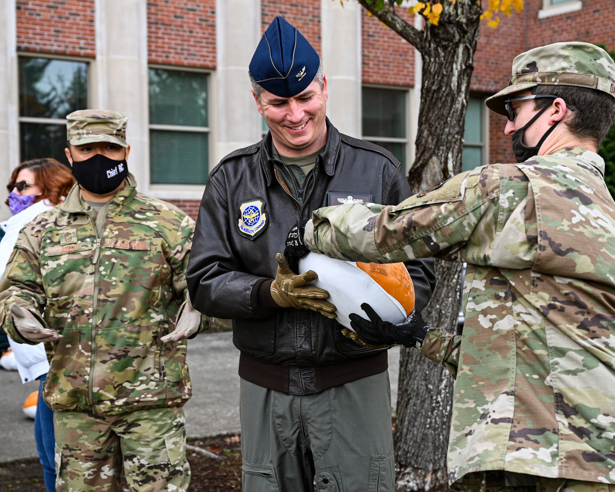 U.S. Air Force Airmen with Team McChord help distribute turkeys during Operation Turkey Drop at Joint Base Lewis-McChord, Wash., Nov. 18, 2021. The Air Force Association McChord Field Chapter and the Pierce Military and Business Alliance organized the drop of more than 300 turkeys to Airmen at Joint Base Lewis-McChord for the Thanksgiving holiday. (U.S. Air Force photo by Master Sgt. Julius Delos Reyes)