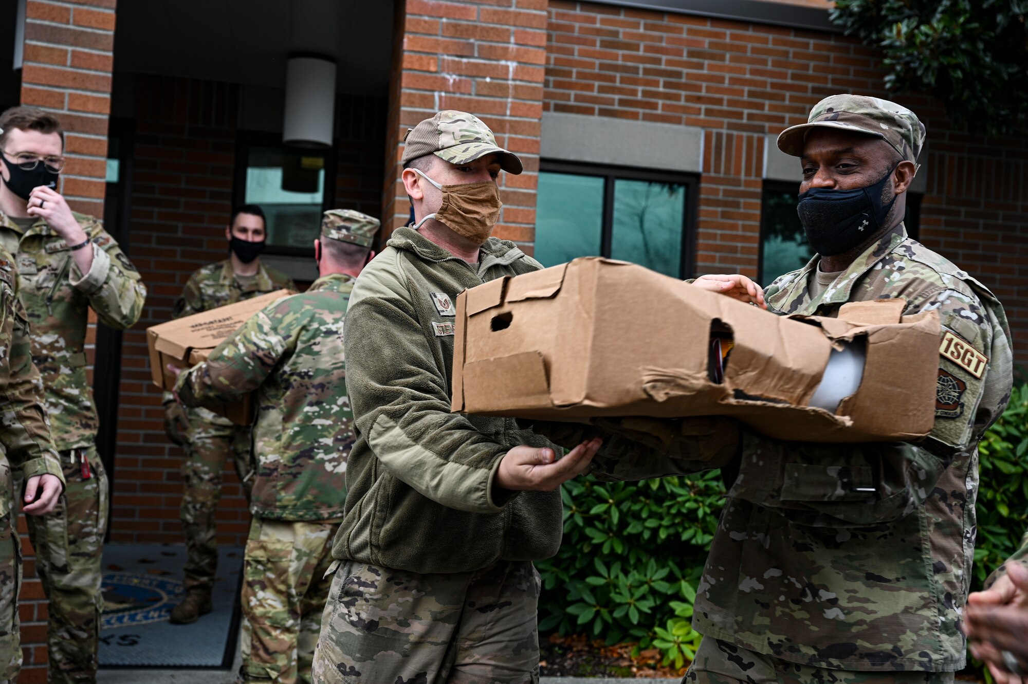 U.S. Air Force Airmen with Team McChord help distribute turkeys during Operation Turkey Drop at Joint Base Lewis-McChord, Wash., Nov. 18, 2021. The Air Force Association McChord Field Chapter and the Pierce Military and Business Alliance organized the drop of more than 300 turkeys to Airmen at Joint Base Lewis-McChord for the Thanksgiving holiday. (U.S. Air Force photo by Master Sgt. Julius Delos Reyes)