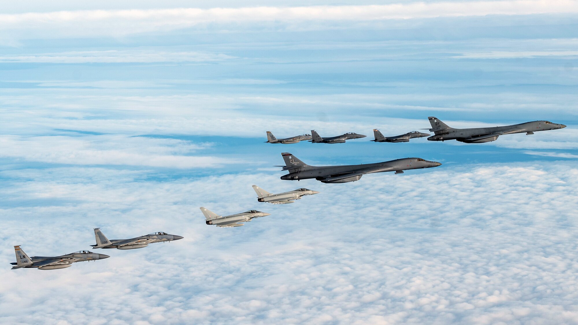 U.S. Air Force F-15C Eagles, F-15E Strike Eagles, and Royal Air Force Typhoon FGR4s escort B-1 Lancers during a bomber task force mission in the North Sea Region