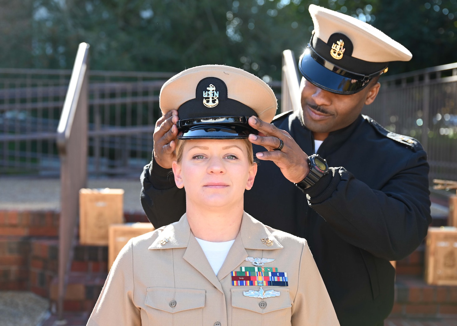 Chief Logistics Specialist Jennifer Fasnacht stands proud as her chief petty officer combination cover is donned during the chief petty officer pinning ceremony at POW/MIA Park, Nov. 19, 2021.