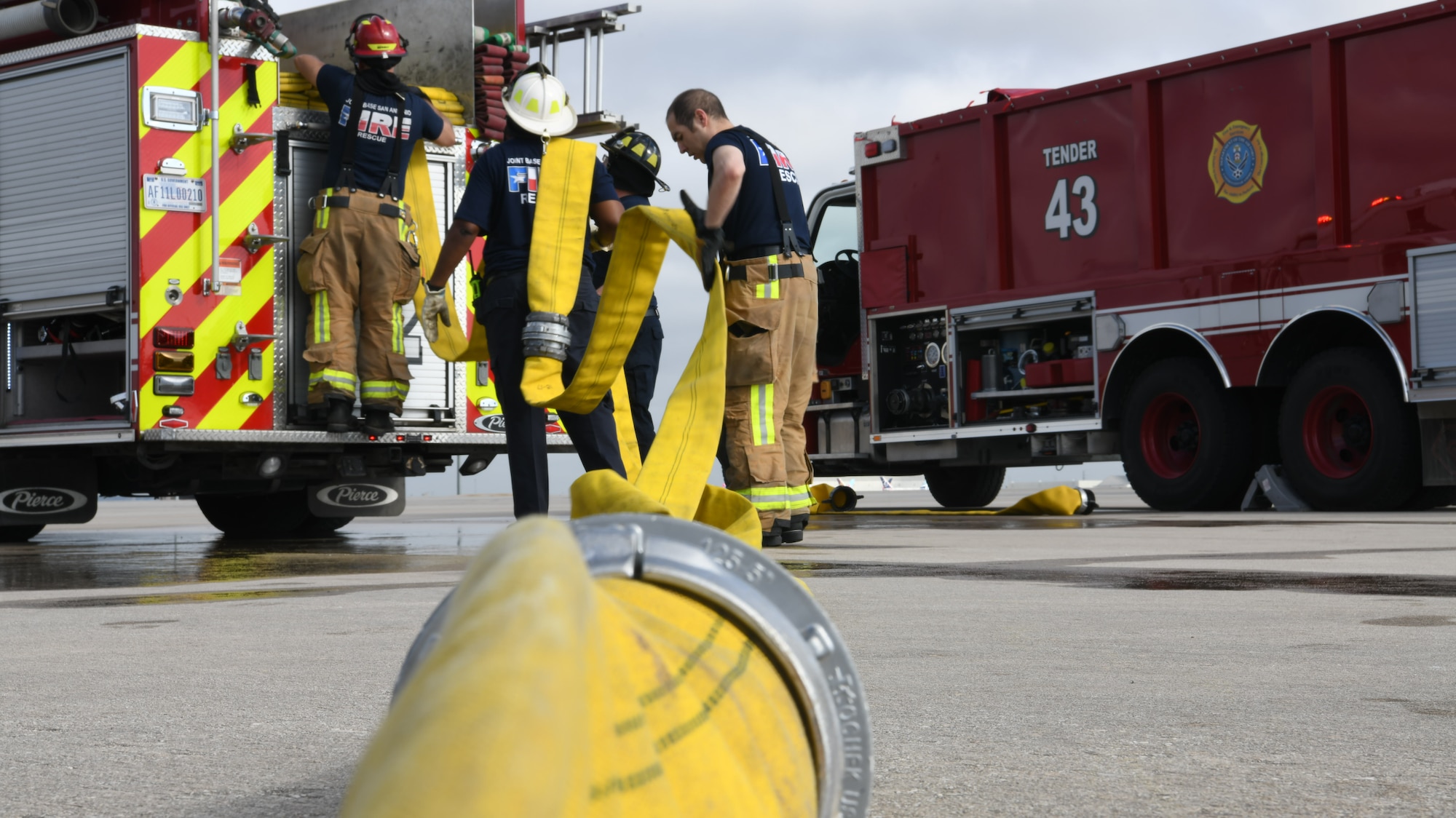 902nd Civil Engineer Squadron firefighters return their equipment to a ready-state following a total force training exercise with the 433rd Airlift Wing Nov. 15, 2021, at Joint Base San Antonio-Lackland, Texas. The firefighters responded to a simulated brake fire on a C-5M Super Galaxy cargo aircraft. (U.S. Air Force photo by Master Sgt. Kristian Carter)