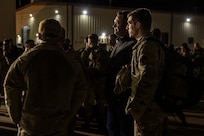 Airmen assigned to the 7the Bomb Wing wait for luggage with families after their return to Dyess Air Force Base, Texas, Nov. 18, 2021 from a Bomber Task Force Europe deployment.