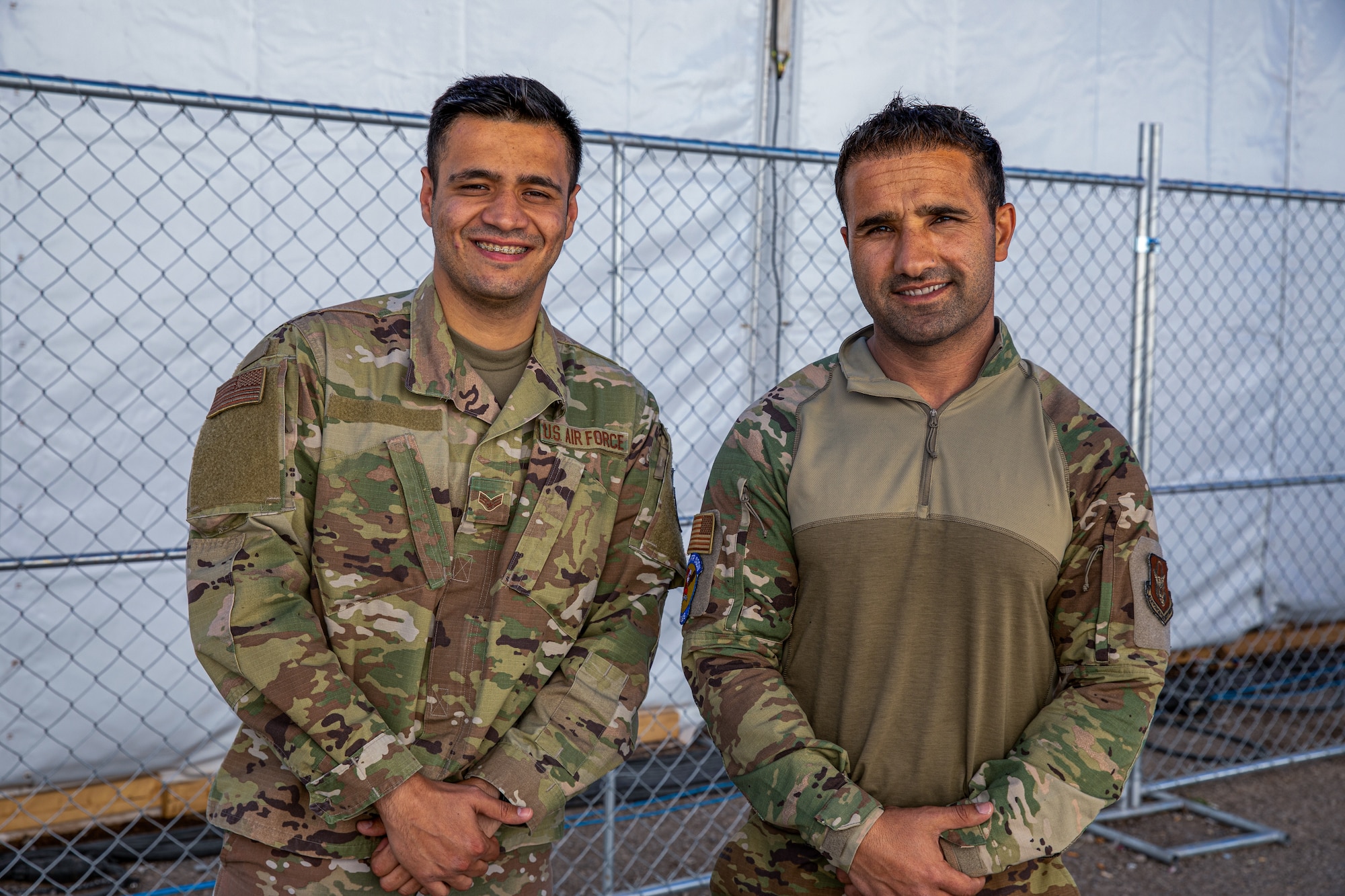 Photo of Senior Airman Kalimullah Ghorbandi (left) and Airman 1st Class Ahmed Sofizada (right) , both linguists assigned to Task Force Holloman.