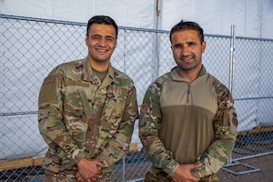 Photo of Senior Airman Kalimullah Ghorbandi (left) and Airman 1st Class Ahmed Sofizada (right) , both linguists assigned to Task Force Holloman.