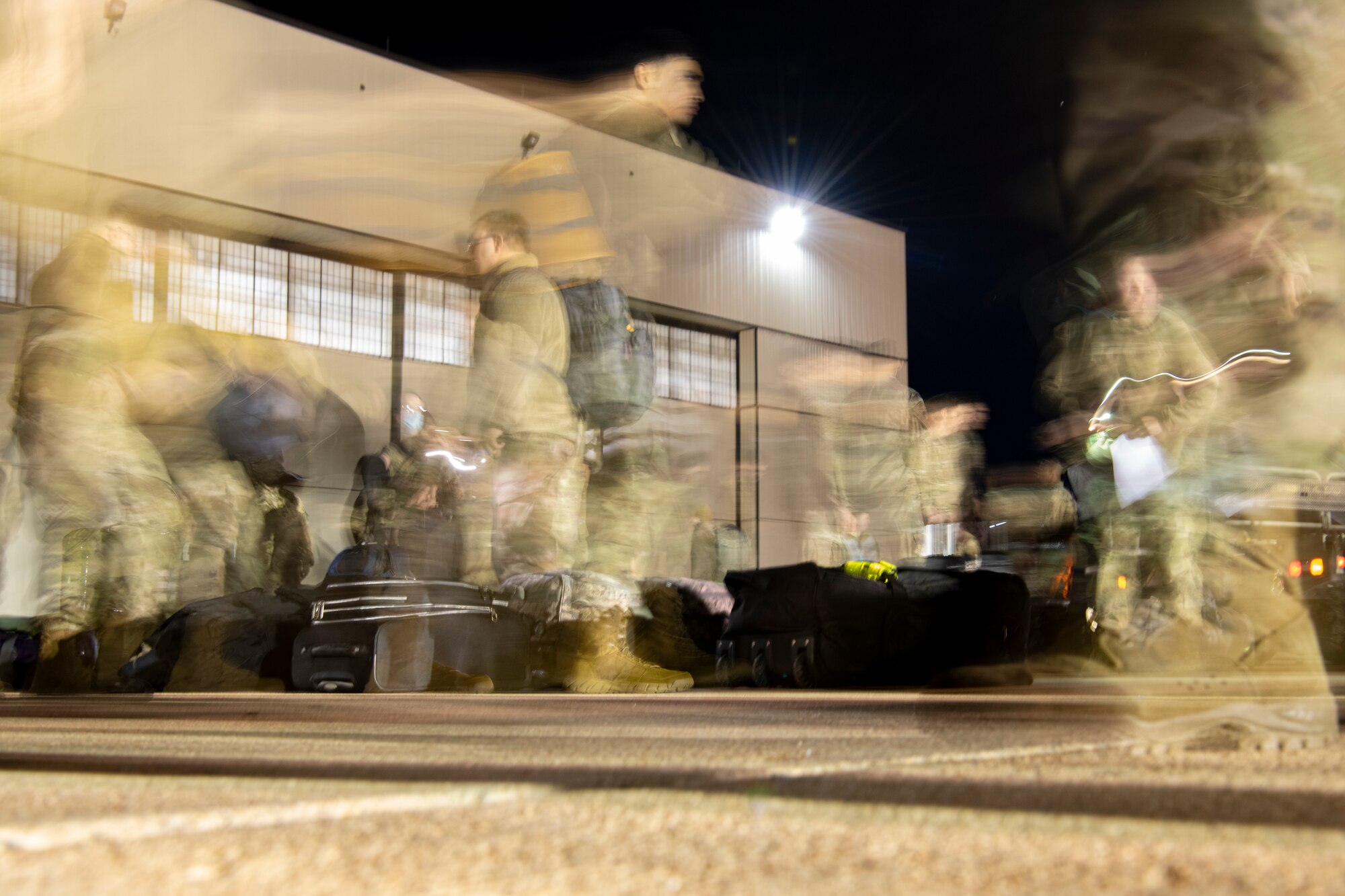 Airmen assigned to the 7th Bomb Wing get  their luggage after returning to Dyess Air Force Base, Texas, Nov. 18, 2021, from a Bomber Task Force Europe deployment.