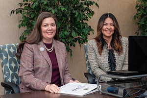 Photo of Janis Scobee, Air Force Reserve Command senior key spouse, and Edith White, Air Force Reserve Command senior enlisted key spouse, posing for a photo before delivering closing remarks for the 2021 AFRC Virtual Key Spouse Conference Nov. 10, 2021.