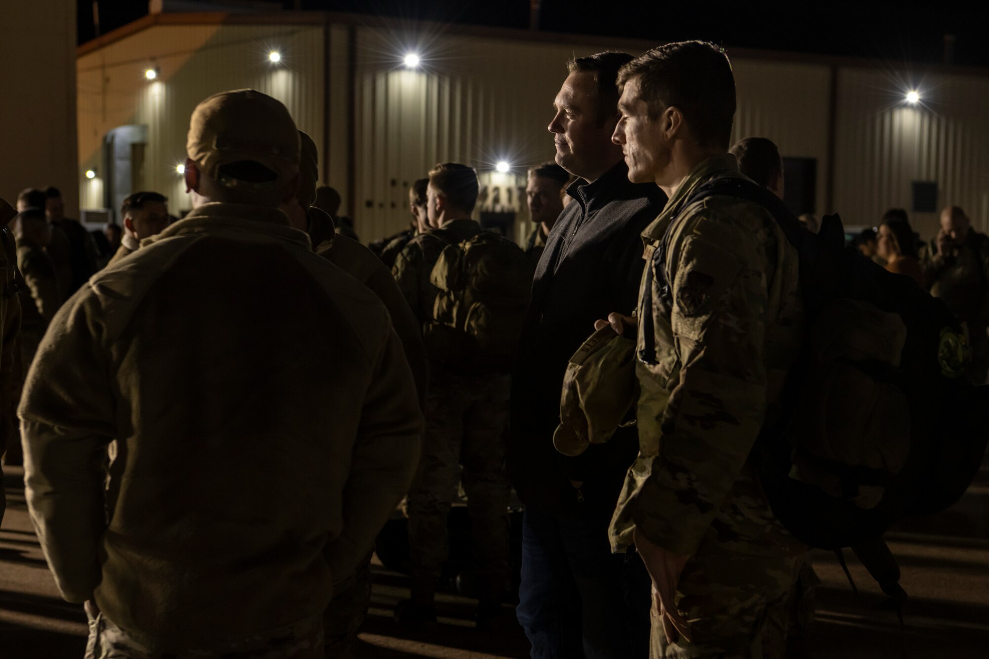 Airmen assigned to the 7the Bomb Wing wait for luggage with families after their return to Dyess Air Force Base, Texas, Nov. 18, 2021 from a Bomber Task Force Europe deployment.
