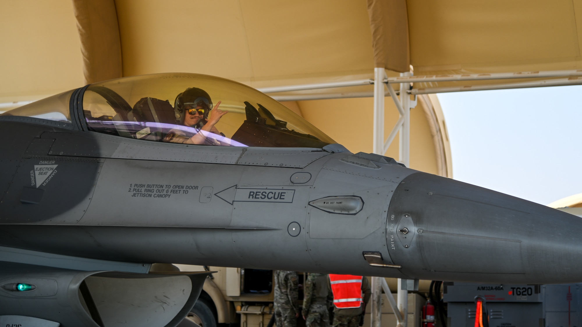 First Lt. Alexander Abbott, 176th Expeditionary Fighter Squadron pilot, poses for a photo during an Integrated Combat Turn at Prince Sultan Air Base, Kingdom of Saudi Arabia, Nov. 18, 2021. Performing ICTs allows the aircrew to spend less time on the ground and increases the time they can fly supporting operations. (U.S. Air Force photo by Staff Sgt. Christina Graves)