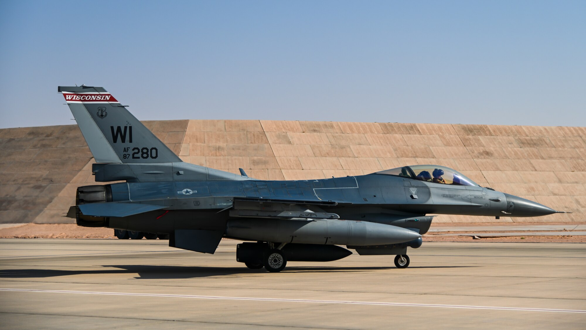 An F-16 Fighting Falcon from the 176th Expeditionary Fighter Squadron taxis to the runway after completing an Integrated Combat Turn at Prince Sultan Air Base, Kingdom of Saudi Arabia, Nov. 18, 2021. An ICT is the rearmament and refueling of a running aircraft in order to decrease the time aircrew spend on the ground. (U.S. Air Force photo by Staff Sgt. Christina Graves)