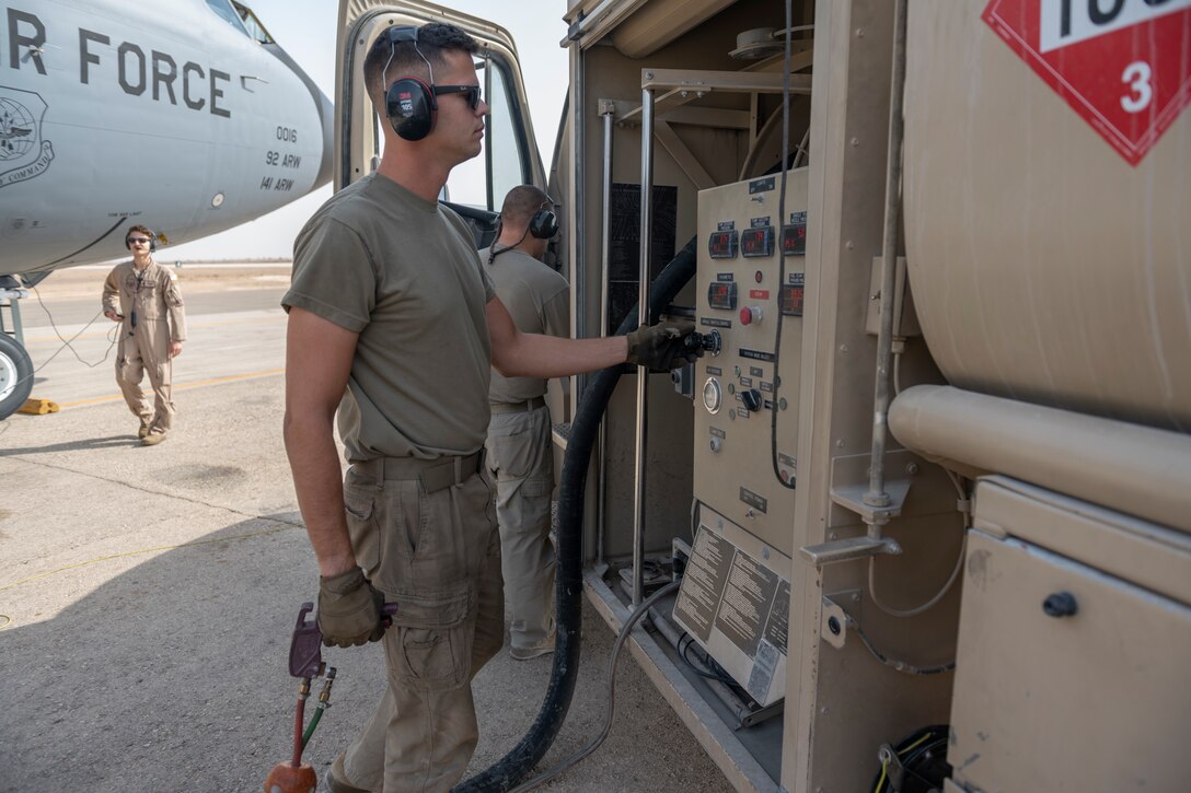 U.S. Air Force Senior Airman Johnathan Lynch, 332nd Expeditionary Logistics Readiness Squadron fuel distribution operator, monitors fuel being transferred to a KC-135 Stratotanker