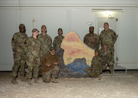 U.S. Airmen with the 332nd Air Expeditionary Wing pose for a photo