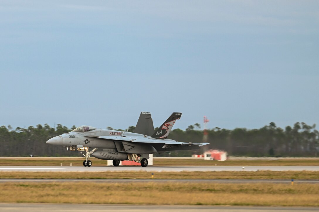 An F-18 lands on a runway