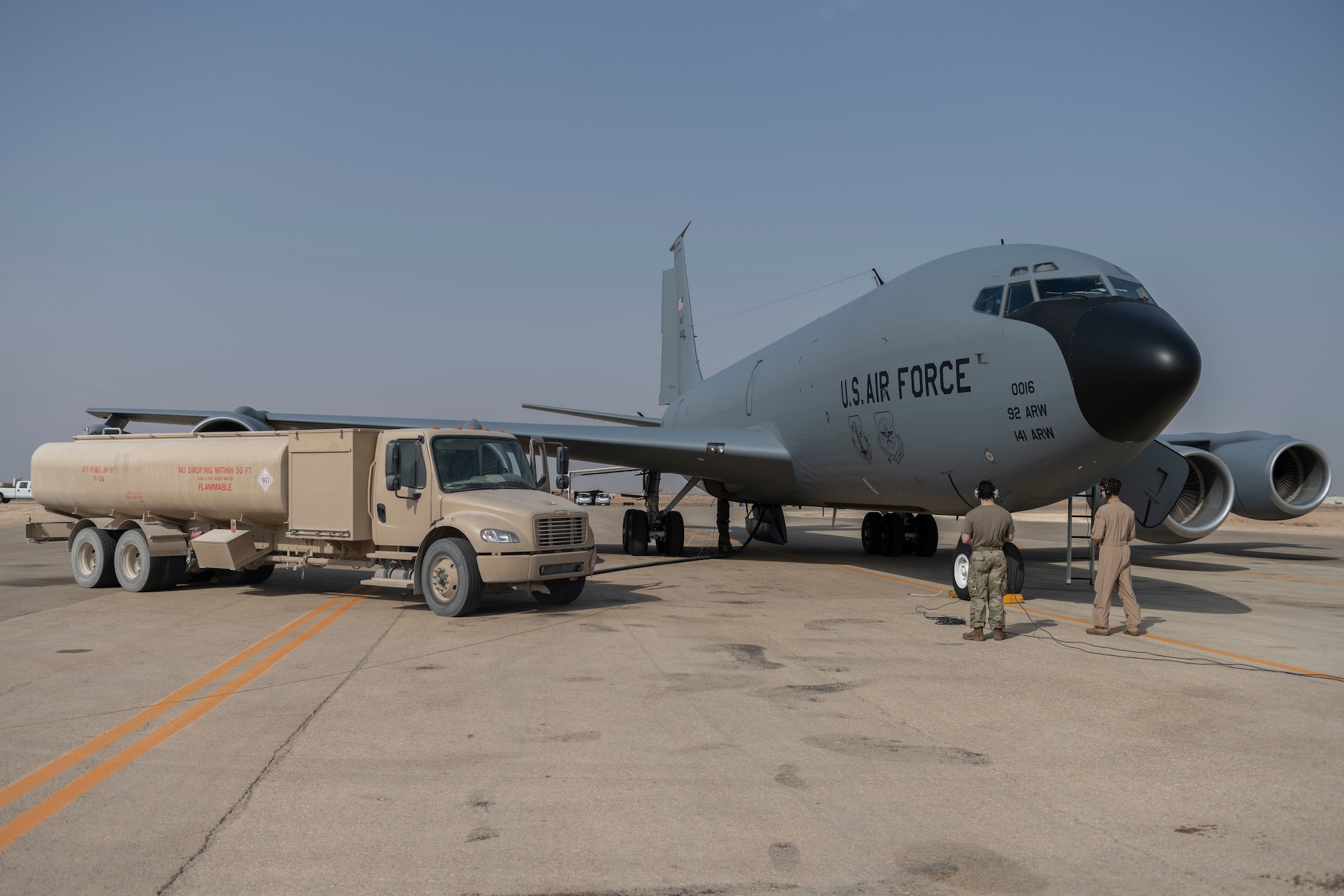 An R-11 fuel truck refuels a KC-135 Stratotanker