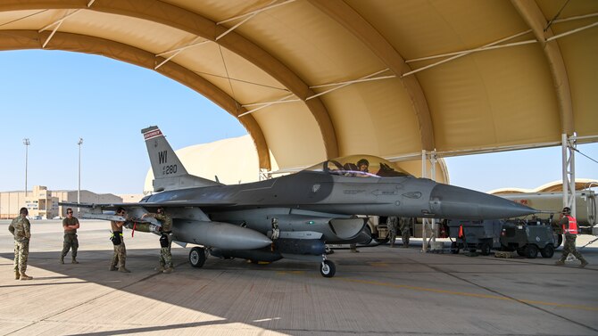 Airmen from the 176th Expeditionary Fighter Generation Squadron and the 176th Expeditionary Fighter Squadron perform an Integrated Combat Turn at Prince Sultan Air Base, Kingdom of Saudi Arabia, Nov. 18, 2021. An ICT is the quick rearming and refueling of a running jet to reduce the aircrew’s time on the ground and increases the 176th Expeditionary Fighter Squadron’s ability to conduct and sustain combat operations. (U.S. Air Force photo by Staff Sgt. Christina Graves)