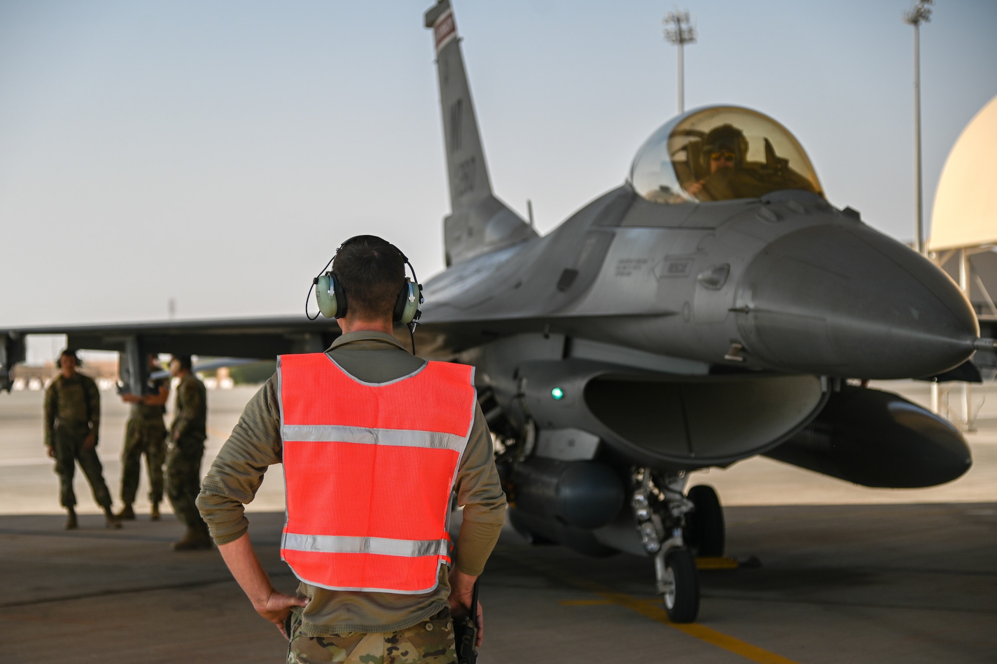 Tech. Sgt. Zechariah Postler, 176th Expeditionary Fighter Generation Squadron crew chief, takes part in an Integrated Combat Turn at Prince Sultan Air Base, Kingdom of Saudi Arabia, Nov. 18, 2021. An ICT is the quick rearming and refueling of a running jet to reduce the aircrew’s time on the ground and increases the 176th Expeditionary Fighter Squadron’s ability to conduct and sustain combat operations. (U.S. Air Force photo by Staff Sgt. Christina Graves)
