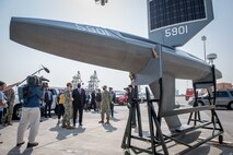Secretary of Defense Lloyd J. Austin speaks to U.S. Navy personnel about the Saildrone Explorer unmanned surface vessel, attached to Task Force (TF) 59, at Naval Support Activity Bahrain, Nov. 21. TF 59 is the first U.S. Navy task force of its kind, designed to rapidly integrate unmanned systems and artificial intelligence with maritime operations in the U.S. 5th Fleet area of operations.