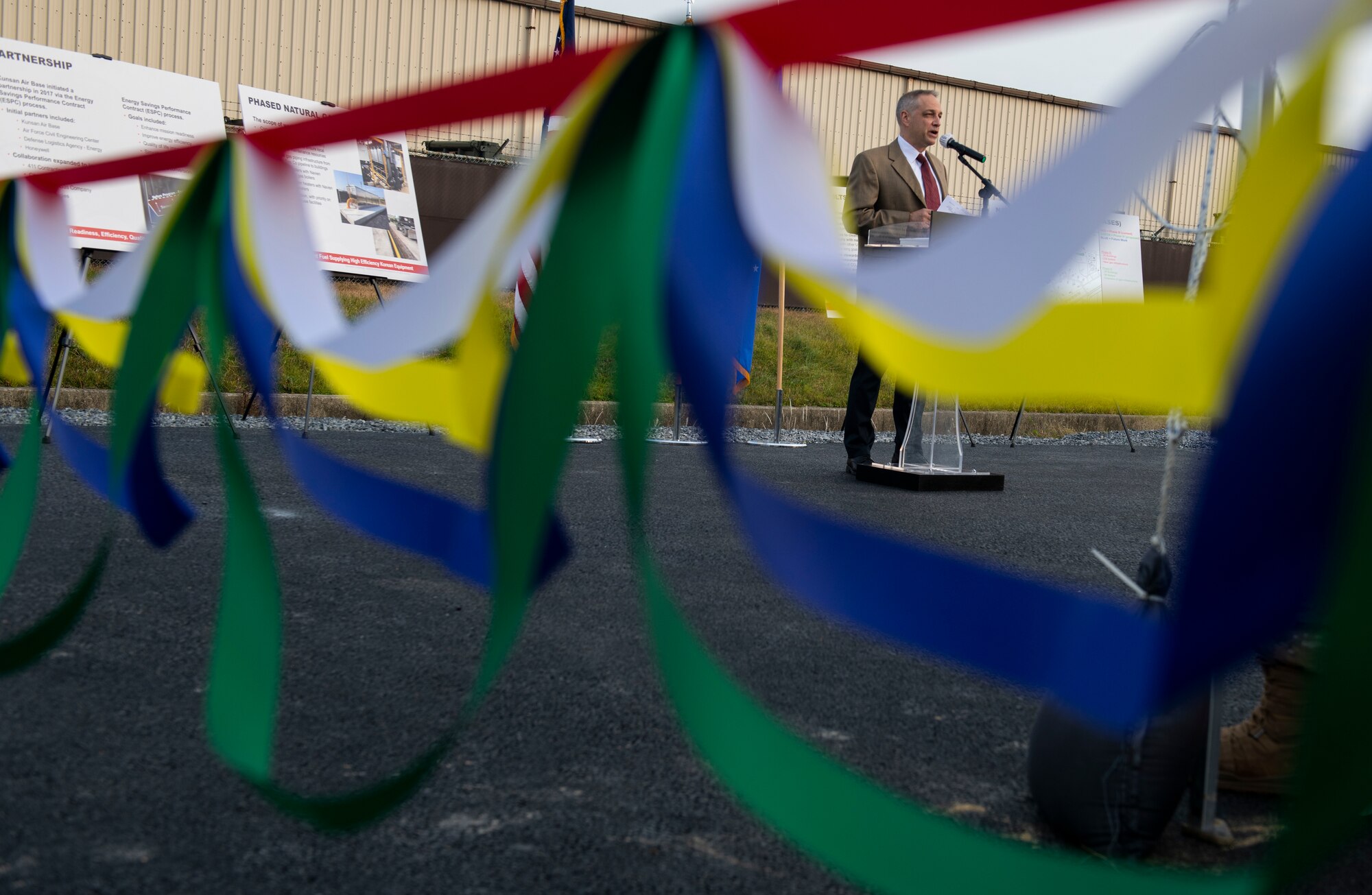 John Bethea, Honeywell senior business consultant, gives a speech during the installation’s Natural Gas Ribbon Cutting Ceremony at Kunsan Air Base, Republic of Korea, Nov. 15, 2021. A natural gas pipeline was installed which will provide reliable, sustainable and energy efficient heating to buildings on the installation. (U.S. Air Force photo by Staff Sgt. Suzie Plotnikov)